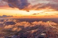 Dramatic sunrise sky with low clouds over the urban panoramic landscape view