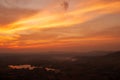 Dramatic sunrise sky over a lake in a valley