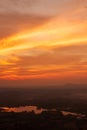 Dramatic sunrise sky over a lake in a valley