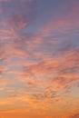 Dramatic sunrise, sunset pink orange blue sky with cirrus clouds in sunlight abstract background texture Royalty Free Stock Photo