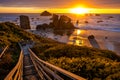 Dramatic Sunset at Bandon Beach with stairs leading to beach level.