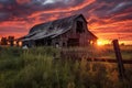 dramatic sunset behind a dilapidated barn