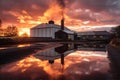 dramatic sunset behind a picturesque whisky distillery