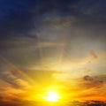 Dramatic sunset with bright rays and clouds