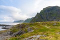 Dramatic sunset clouds moving over steep mountain peaks, Lofoten islands, Norway Royalty Free Stock Photo