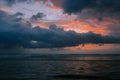 Dramatic sunset clouds reflected on the water sea. Tropical beach landscape Royalty Free Stock Photo