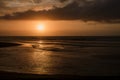 Dramatic sunset clouds reflected on the water sea. Tropical beach landscape Royalty Free Stock Photo