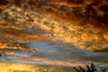 Dramatic sunset cloudy sky with clouds lit by sunset sunlight Royalty Free Stock Photo