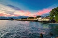 Lahaina harbor at sunset with view of the ocean side of Front Street shops.