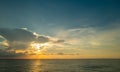 Dramatic sunset and cloudy sky. sea. Calm sea with cloudy sky through the clouds over. Sunset ocean and cloudy sky Royalty Free Stock Photo