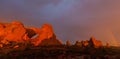 Dramatic sunset colors, clouds and rain in Arches National Park desert Royalty Free Stock Photo