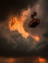 Dramatic Sunset With Container Hanging Over Stormy Clouds at a Shipping Yard Royalty Free Stock Photo