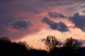 Dramatic sunset with dark clouds and glimpses of light. Royalty Free Stock Photo