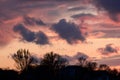 Dramatic sunset with dark clouds and glimpses of light. Royalty Free Stock Photo