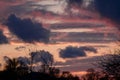 Dramatic sunset with dark clouds and glimpses of light. Royalty Free Stock Photo