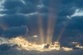 Dramatic sunset with dark clouds and glimpses of light. Royalty Free Stock Photo