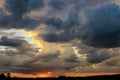 Dramatic sunset with dark clouds, rain, tornado or hurricane Royalty Free Stock Photo
