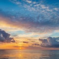 Dramatic sunset evening sky. Fluffy clouds, summer skies, cloudy background. Aerial nature sunrise over the tranquill sea Royalty Free Stock Photo