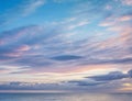 Dramatic sunset evening sky. Fluffy clouds, summer skies, cloudy background. Aerial nature sunrise over the tranquill sea Royalty Free Stock Photo