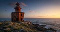 A dramatic sunset illuminates an old abandoned lighthouse covered in seabirds Royalty Free Stock Photo