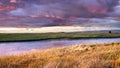 Dramatic sunset landscape with storm clouds reflected in the restored wetlands of South San Francisco Bay Area; Mountain View, Royalty Free Stock Photo