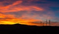Dramatic Sunset Landscape with Wind Turbines Silhouette HDR Royalty Free Stock Photo