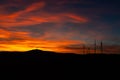 Dramatic Sunset Landscape with Wind Turbines Silhouette HDR Royalty Free Stock Photo