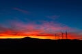 Dramatic Sunset Landscape with Wind Turbines Silhouette HDR Royalty Free Stock Photo