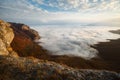 Dramatic sunset landscape in yellow autumn high mountains over clouds. Beautiful scenery of sky Royalty Free Stock Photo