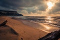 Dramatic sunset at large sandy beach