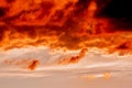 Dramatic sunset like fire in the sky with golden and red clouds. Beautiful abstract colorful background. Selective focus Royalty Free Stock Photo