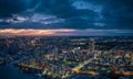 Dramatic sunset lingers in sky over downtown Akashi City at dusk