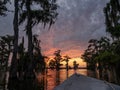 Dramatic Sunset at a Louisiana Bayou Swamp with a Boat Hull in the Foreground Royalty Free Stock Photo