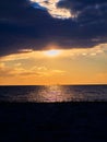 Dramatic sunset near the seaside - industrial structure in the distance