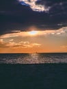 Dramatic sunset near the seaside - industrial structure on the horizon