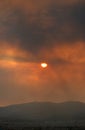 Dramatic sunset over Athens, filtered through the smoke of fires in Attica Royalty Free Stock Photo