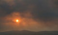 Dramatic sunset over Athens, filtered through the smoke of fires in Attica Royalty Free Stock Photo