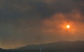Dramatic sunset over Athens, filtered through the smoke of fires in Attica Royalty Free Stock Photo
