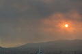 Dramatic sunset over Athens, filtered through the smoke of fires in Attica Royalty Free Stock Photo