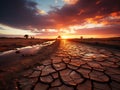 Dramatic sunset over cracked earth Royalty Free Stock Photo