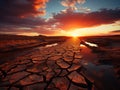 Dramatic sunset over cracked earth