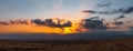 Dramatic sunset over farm fields Royalty Free Stock Photo