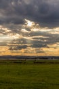 Dramatic sunset over green field Royalty Free Stock Photo