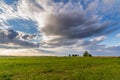 Dramatic sunset over green field Royalty Free Stock Photo