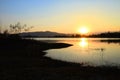 Dramatic sunset over the lake mountains and the sea with Fog of Kaeng Krachan Dam,Phetchaburi Province Thailand. Royalty Free Stock Photo