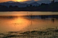 Dramatic sunset over the lake mountains and the sea with Fog of Kaeng Krachan Dam,Phetchaburi Province Thailand. Royalty Free Stock Photo