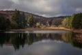 Landscape view of trees with its reflection in the lake. Sliven, Bulgaria Royalty Free Stock Photo