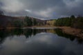 Landscape view of trees with its reflection in the lake. Sliven, Bulgaria Royalty Free Stock Photo