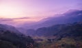 Dramatic sunset over mountain landscape. Beautiful landscape foggy hills twilight time. Blue golden sky sunrise dramatic beautiful Royalty Free Stock Photo