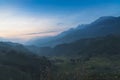 Dramatic sunset over mountain landscape. Beautiful landscape foggy hills twilight time. Blue golden sky sunrise dramatic beautiful Royalty Free Stock Photo